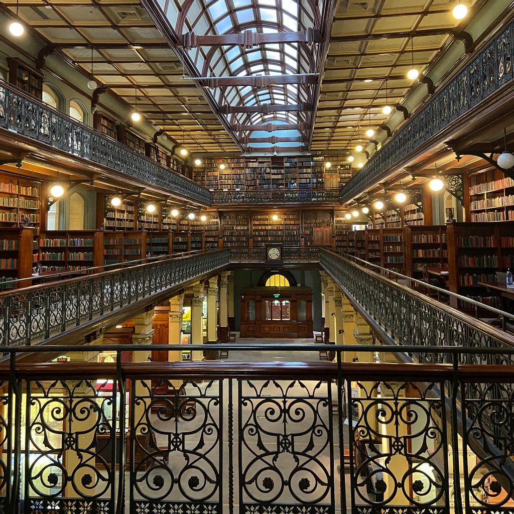 Explore the breathtaking architecture and design of Adelaide's historic library with its unique glass roof and classic decor.