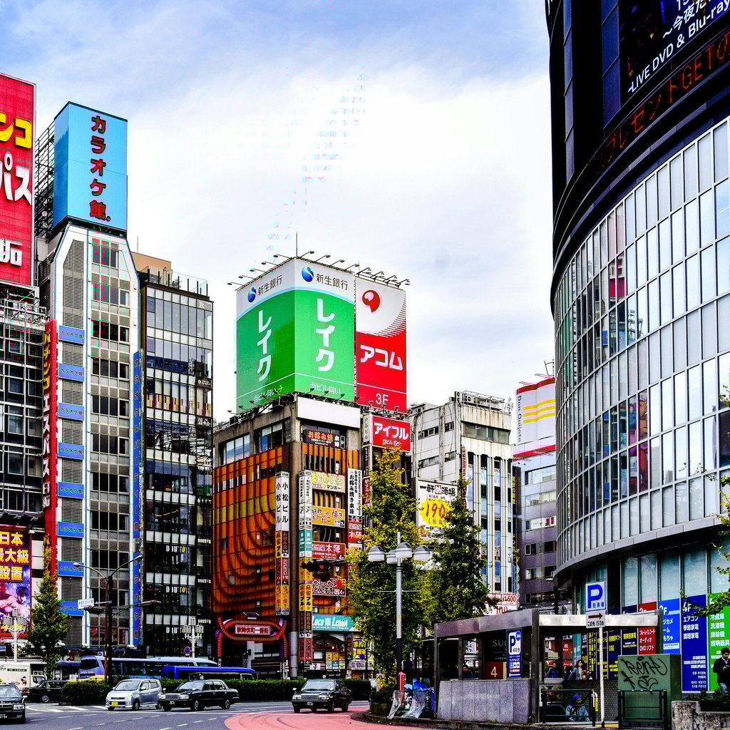 Colorful billboards and architecture in Akihabara, Tokyo on a bright day.