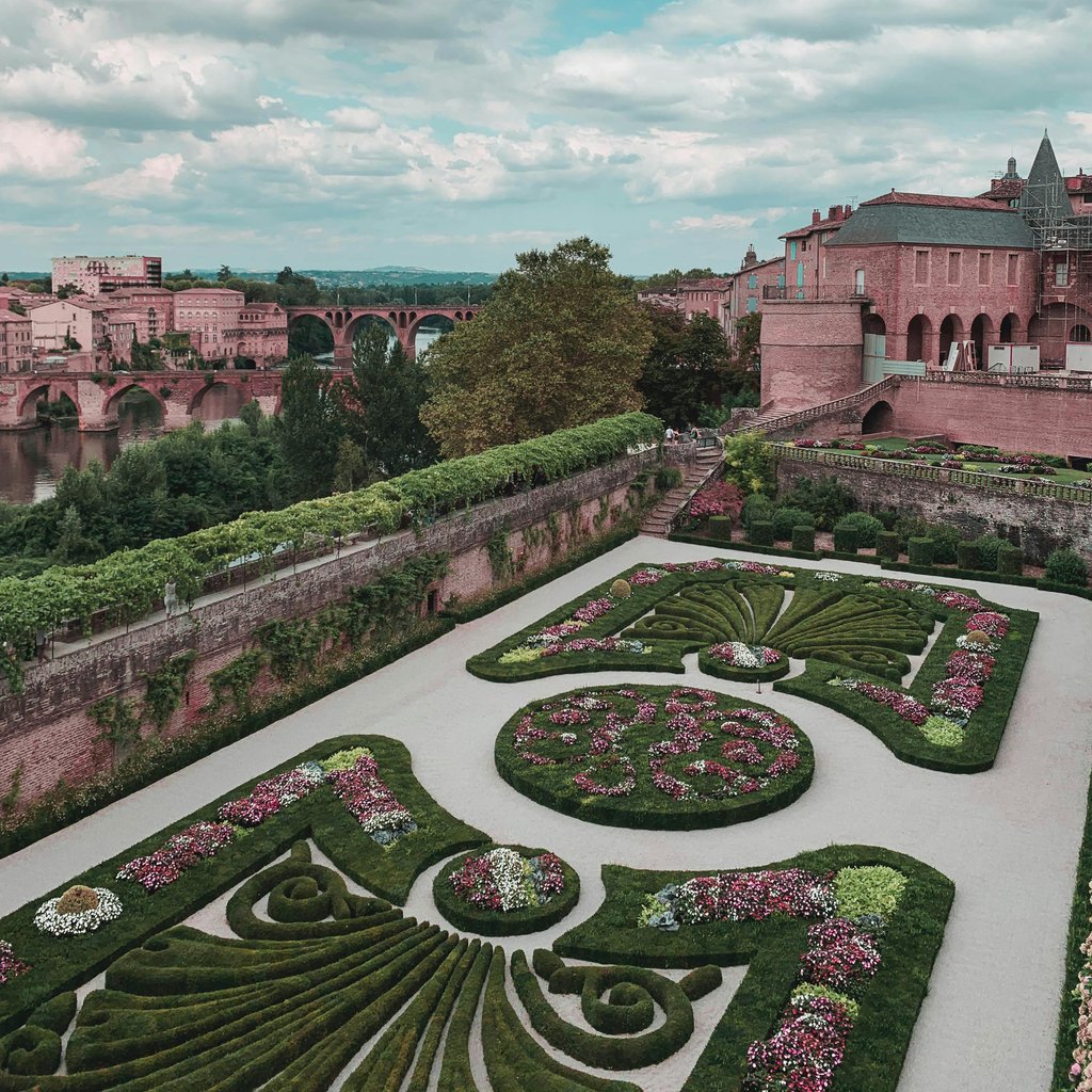 A stunning aerial shot of Albi's gardens and historic architecture in France.