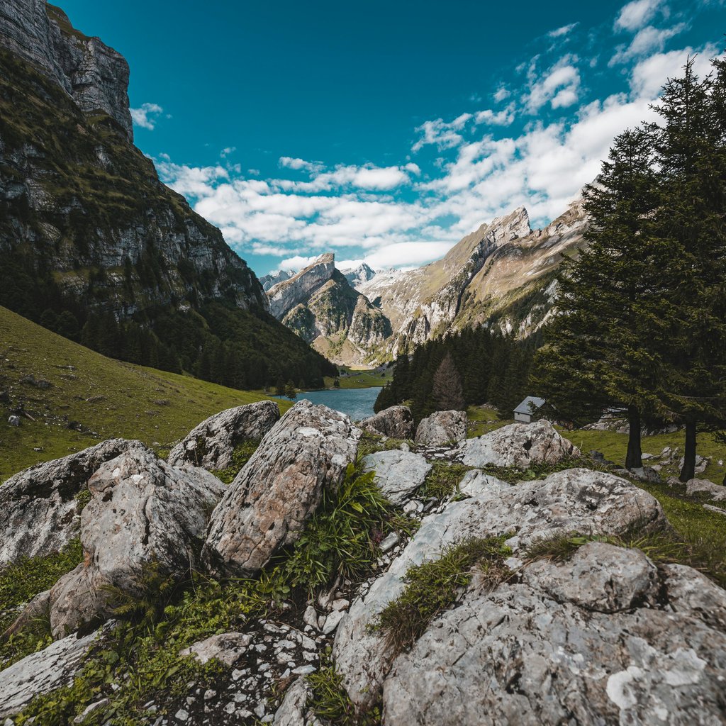 Breathtaking view of Schwende landscape in Switzerland featuring mountainous terrain and a serene river.