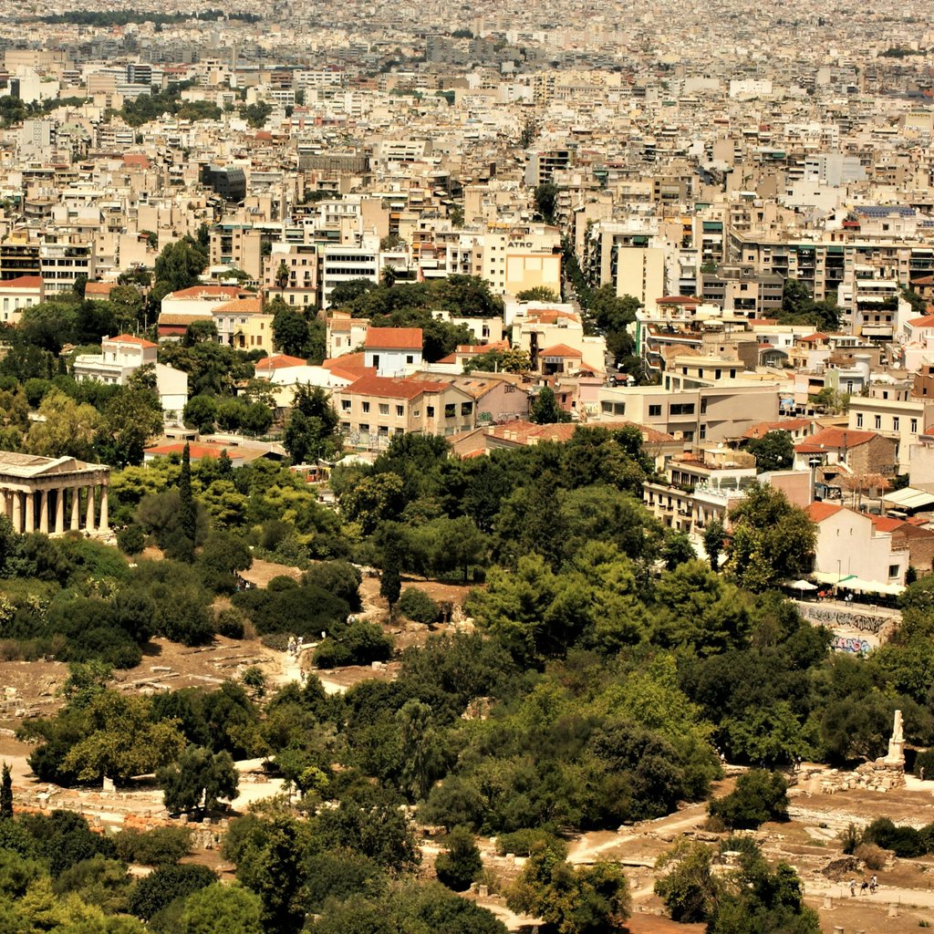 Aerial view showcasing the Ancient Agora and vibrant cityscape of Athens, Greece.
