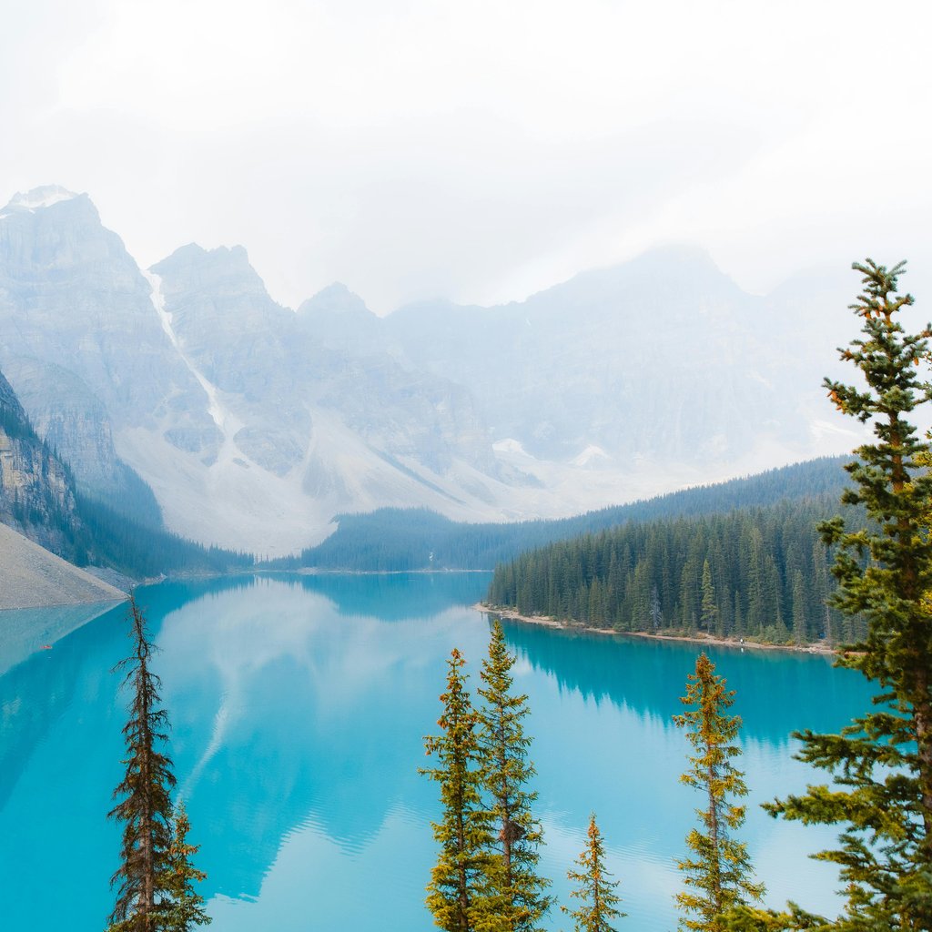 Captivating view of Moraine Lake in Banff National Park, showcasing turquoise waters and majestic mountains.