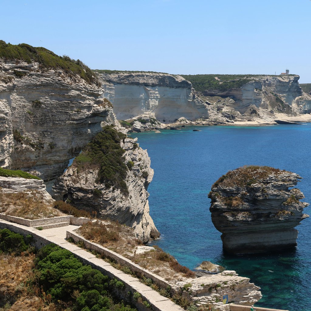 Breathtaking view of Bonifacio cliffs in Corsica with clear blue sea.