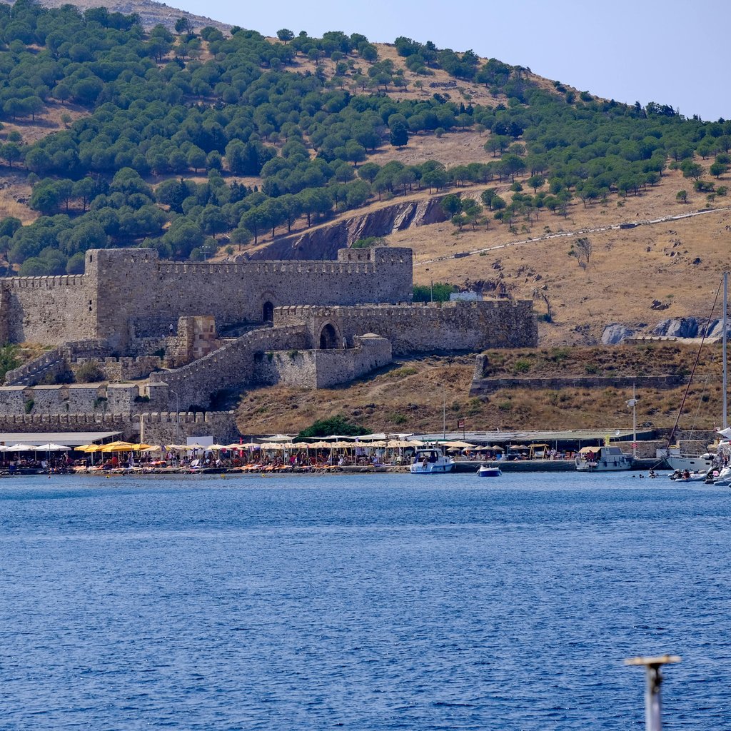 Majestic view of Bozcaada Castle with the Aegean Sea in the foreground. Perfect for history and travel enthusiasts.