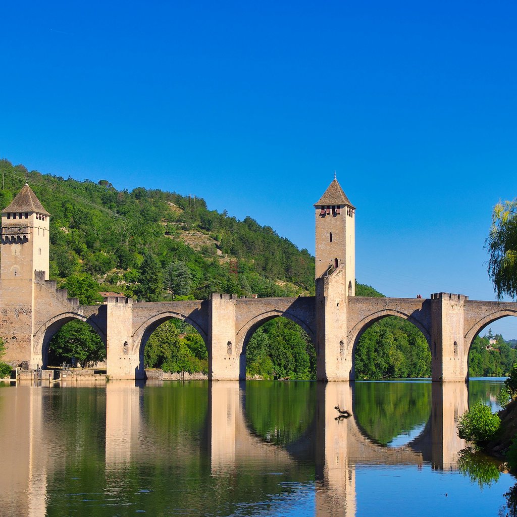 Historic Pont Valentré bridge over Lot River in Cahors, France, a UNESCO World Heritage Site.
