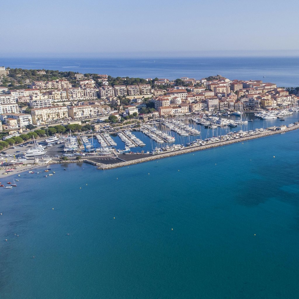 Stunning aerial view of Calvi's marina and citadel, surrounded by the Mediterranean Sea in Corsica.