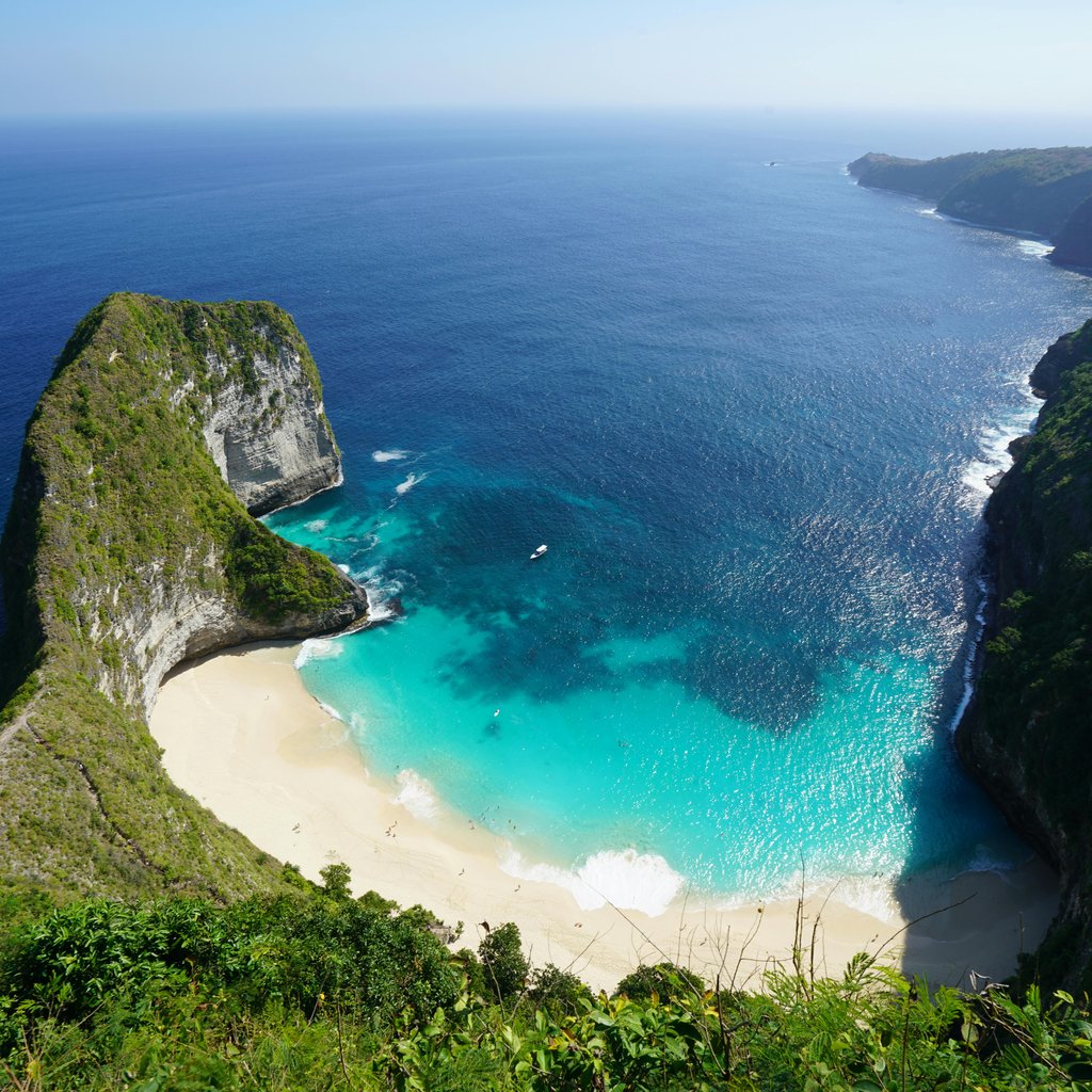 A breathtaking aerial view of the iconic Kelingking Beach on Nusa Penida, Bali, Indonesia.