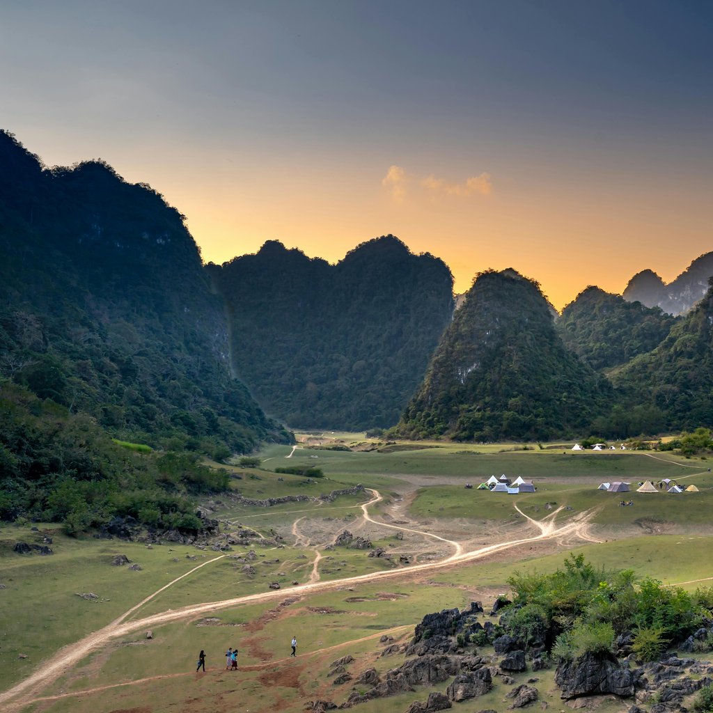 Scenic view of Cao Bang's limestone mountains and valley during sunset, Vietnam.