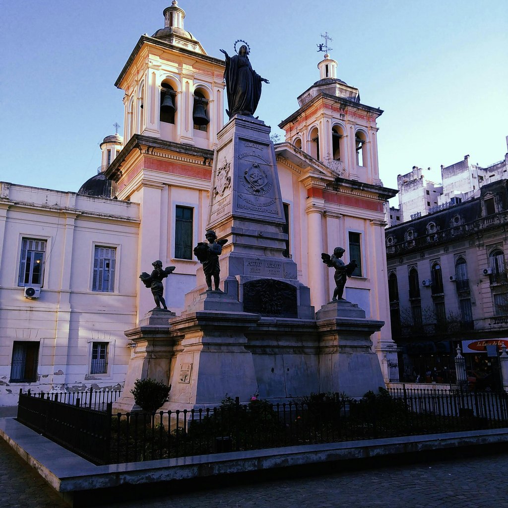 A view of a historic cathedral and monument in Córdoba, showcasing baroque architecture.