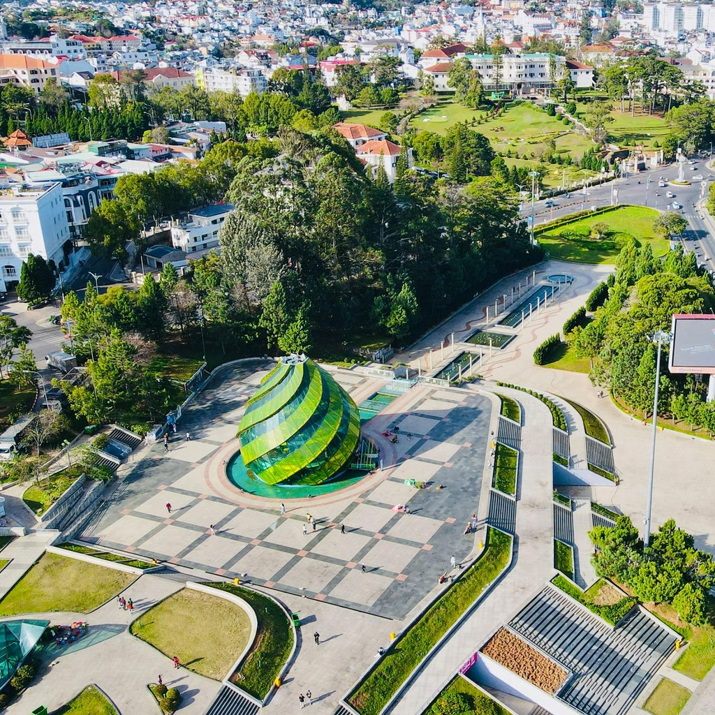 A stunning aerial shot of Lam Vien Square showcasing modern architecture and lush greenery in Đà Lạt, Vietnam.