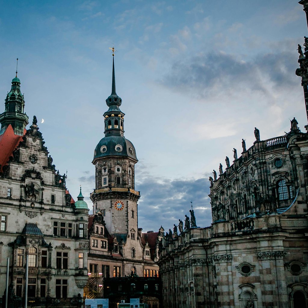 Discover the classic Gothic architecture of the Hausmannsturm Tower in Dresden, Germany's old town square.