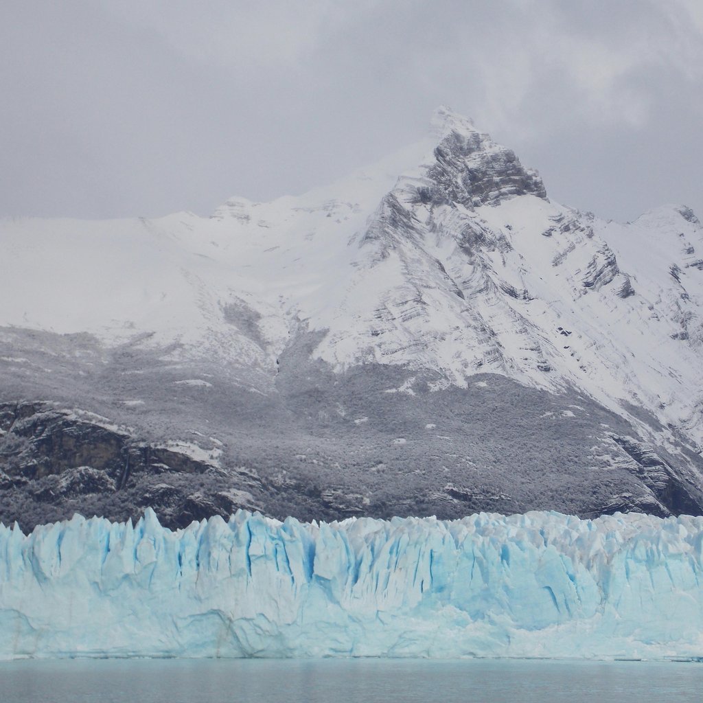 Breathtaking icy glacier and snowy mountain landscape in El Calafate, Argentina.