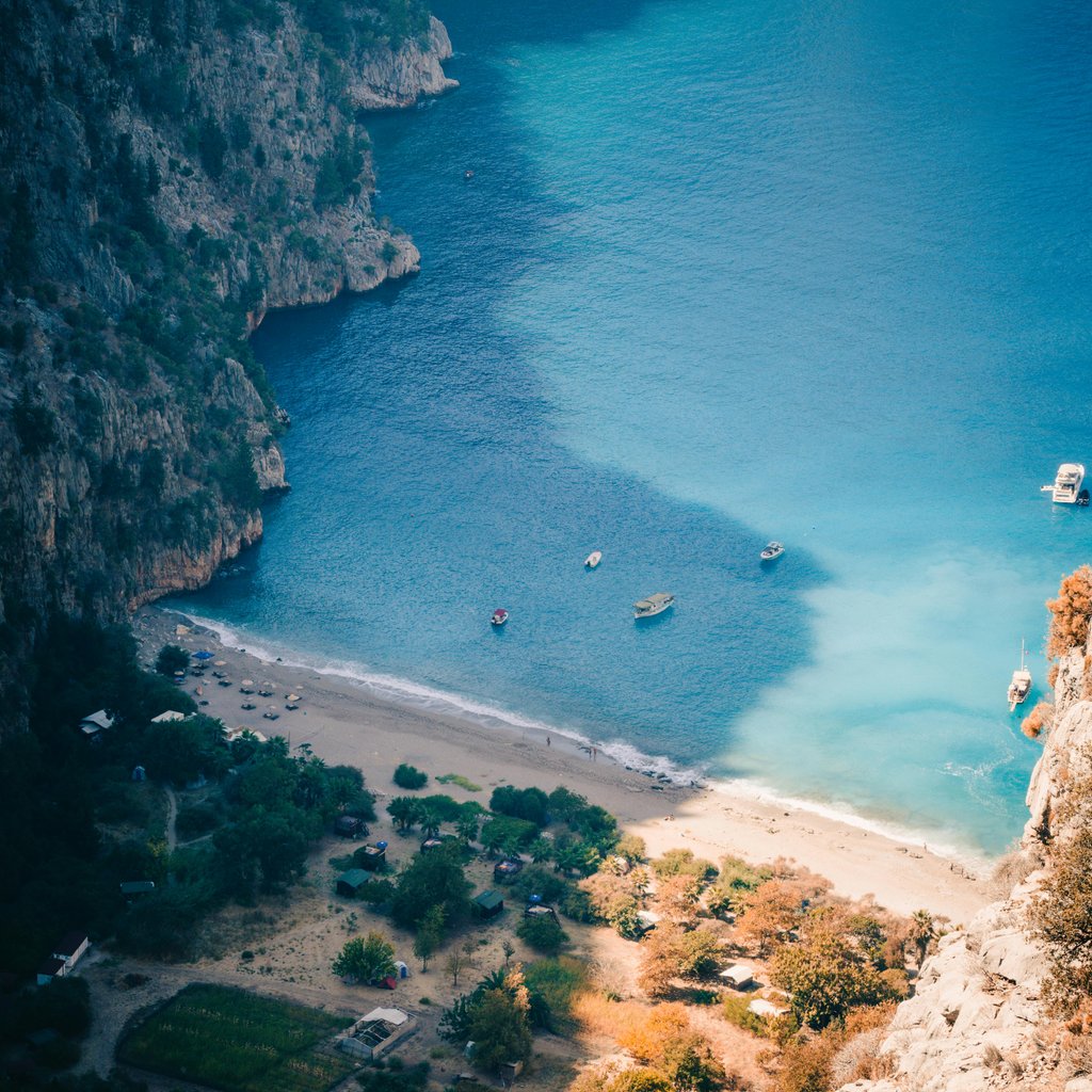 Stunning aerial view of Butterfly Valley, Turkey, showcasing pristine turquoise waters and lush surroundings.