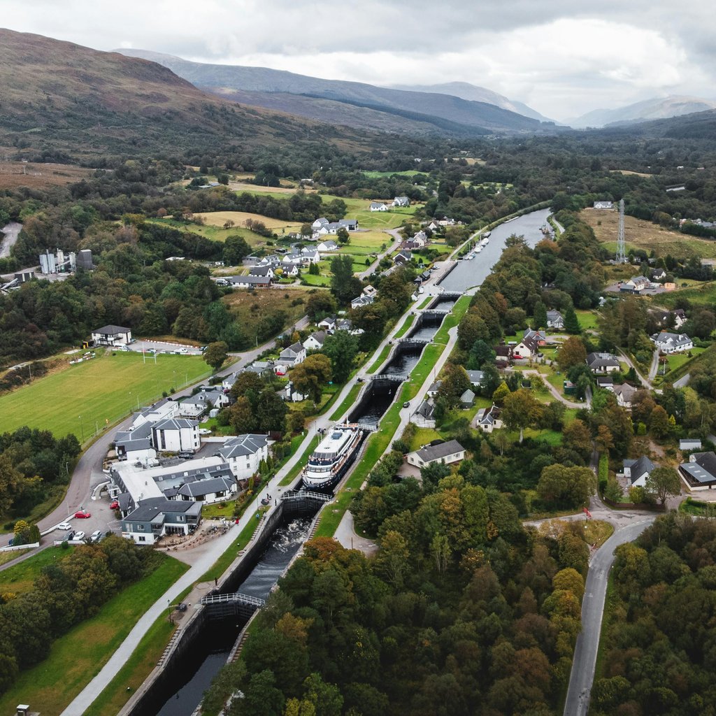 Scenic aerial photograph showcasing Fort William's landscape with locks and lush greenery in Scotland.
