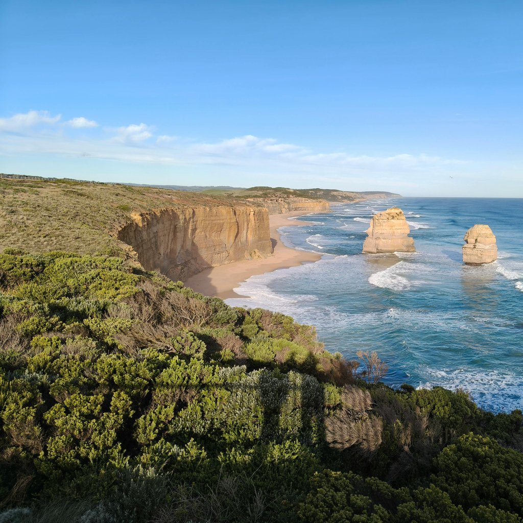 Explore the stunning limestone cliffs and ocean waves along the Great Ocean Road near Lorne, Victoria.