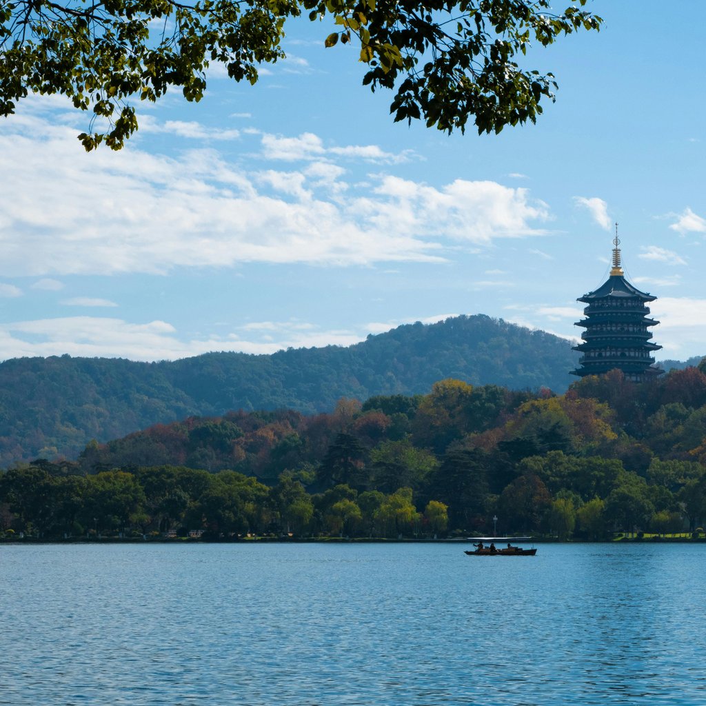 Capture of Leifeng Pagoda amidst autumn foliage at West Lake, Hangzhou, China.