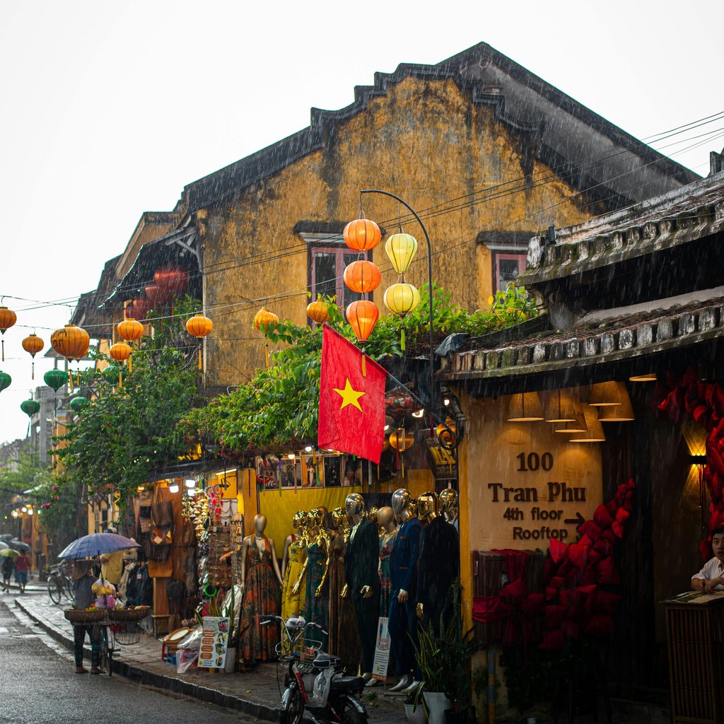 Charming street scene in Hoi An, Vietnam, with vibrant lanterns and traditional architecture.
