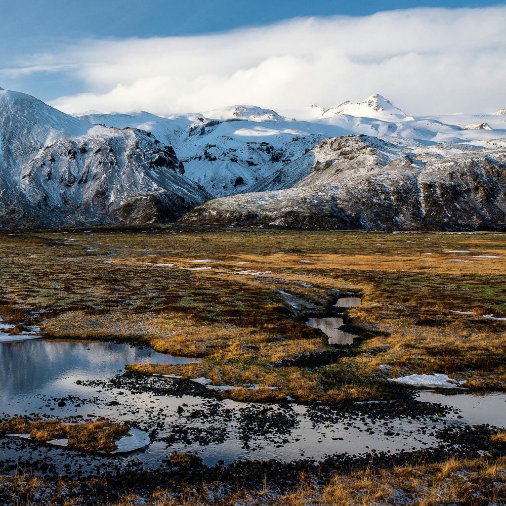 Stunning snow-covered mountains and reflections in Höfn, Iceland.