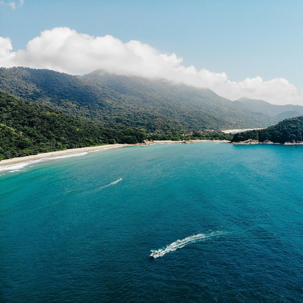 A stunning aerial view of the lush coastline and turquoise waters of Ilha Grande, Rio de Janeiro, Brazil.