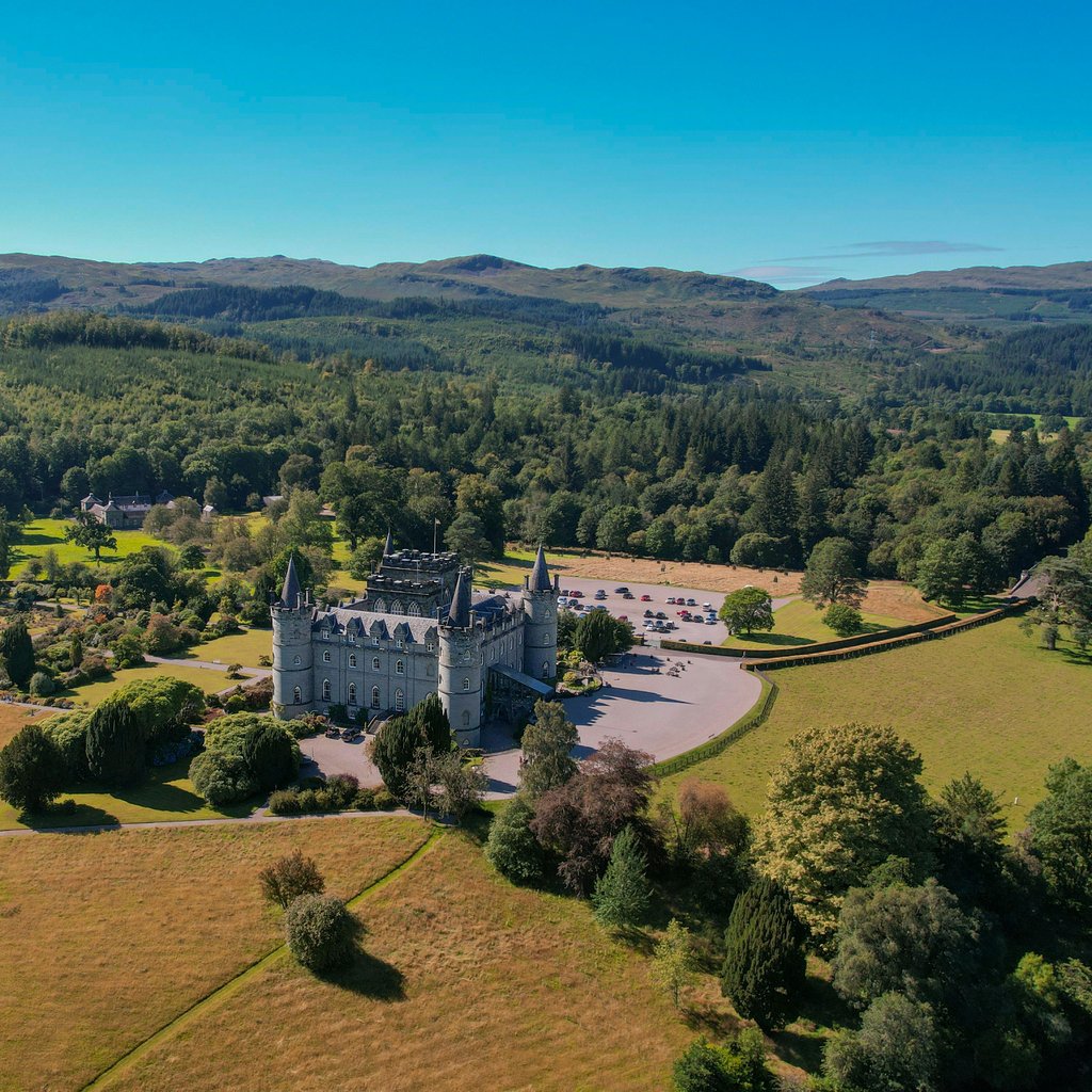 Discover the breathtaking aerial view of Inveraray Castle amidst Scotland's lush landscapes.