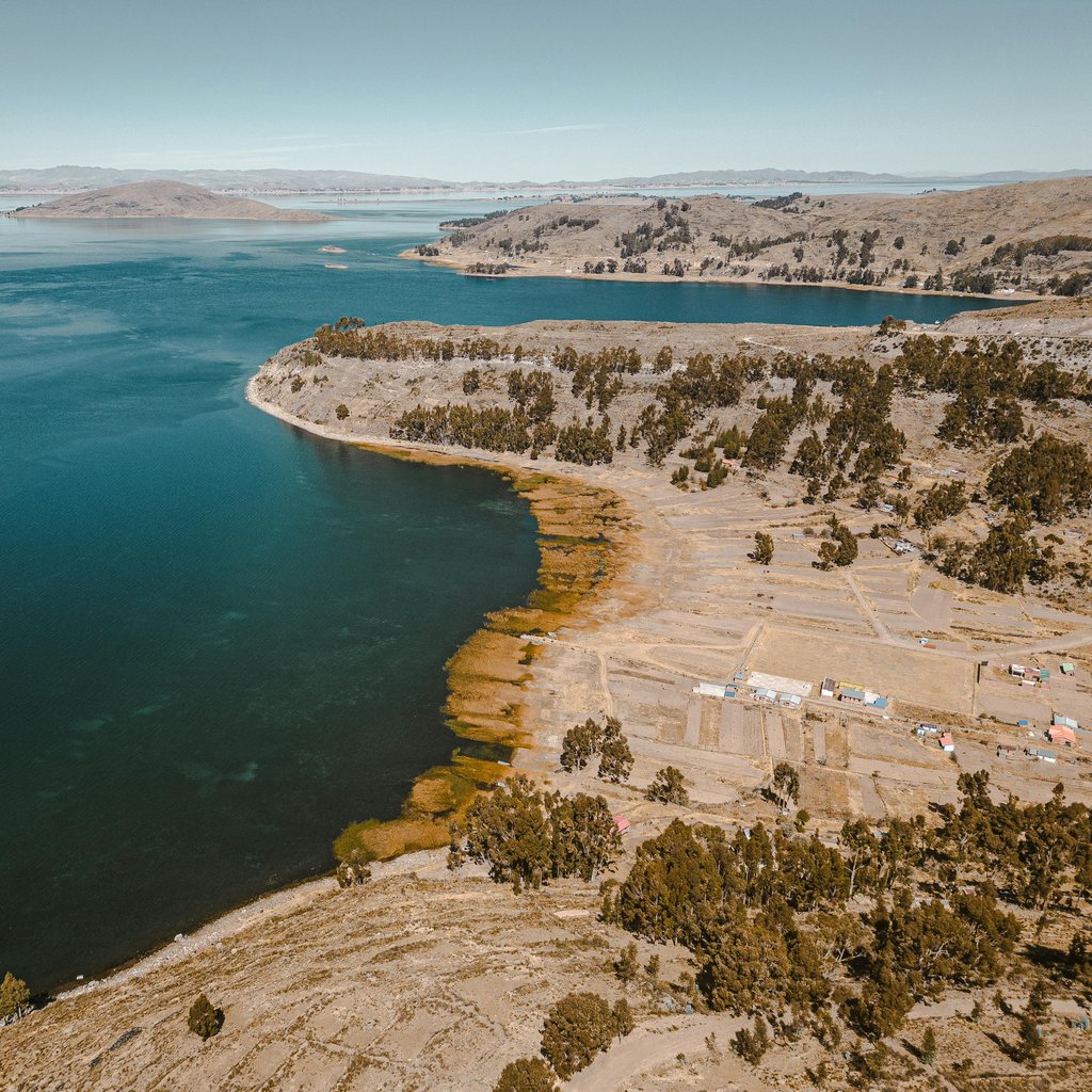 Scenic aerial shot of the coastline and lake in San Pablo De Tiquina, Bolivia, showcasing natural beauty.