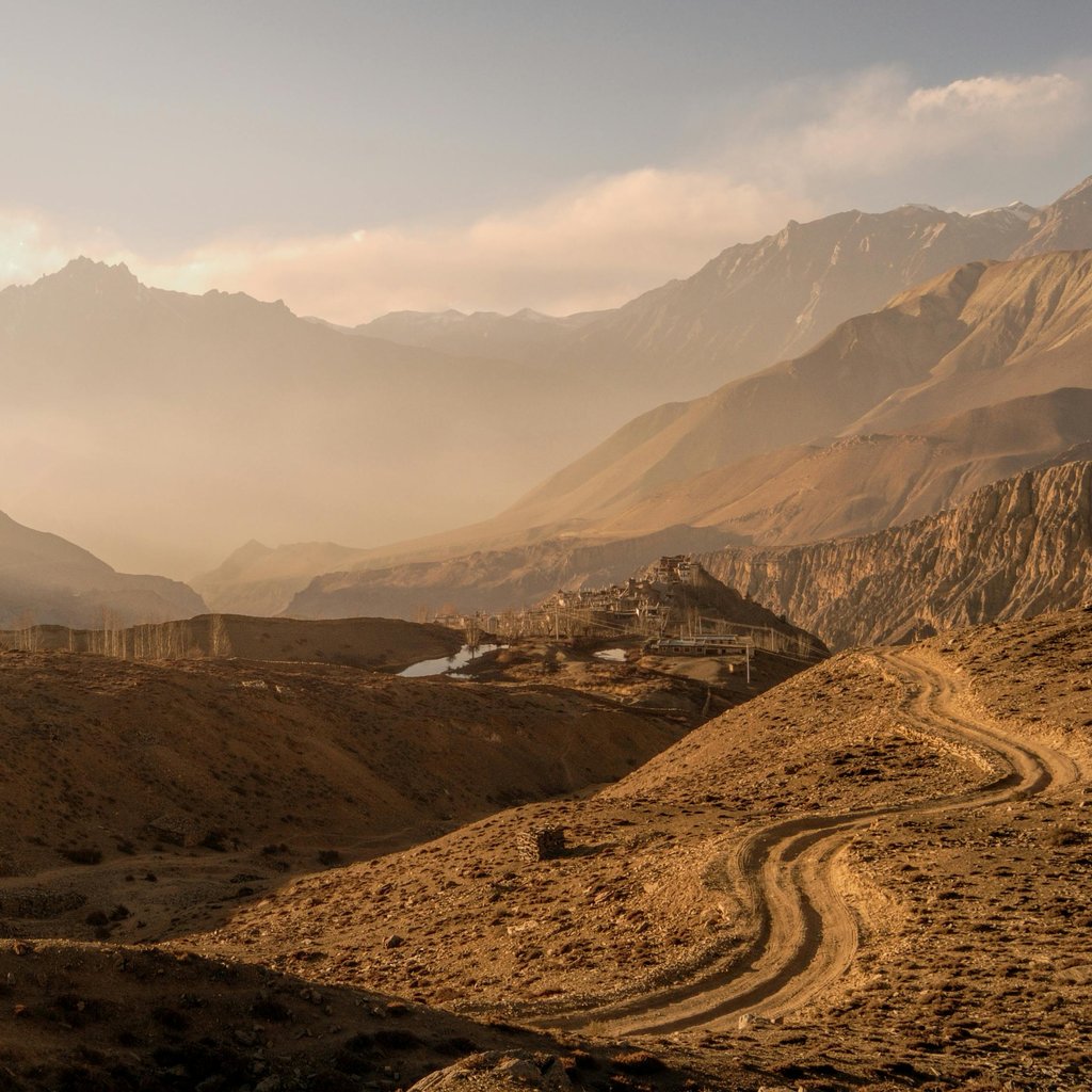 Stunning view of Jomsom's mountainous terrain during sunset, showcasing the natural beauty of Nepal's landscape.