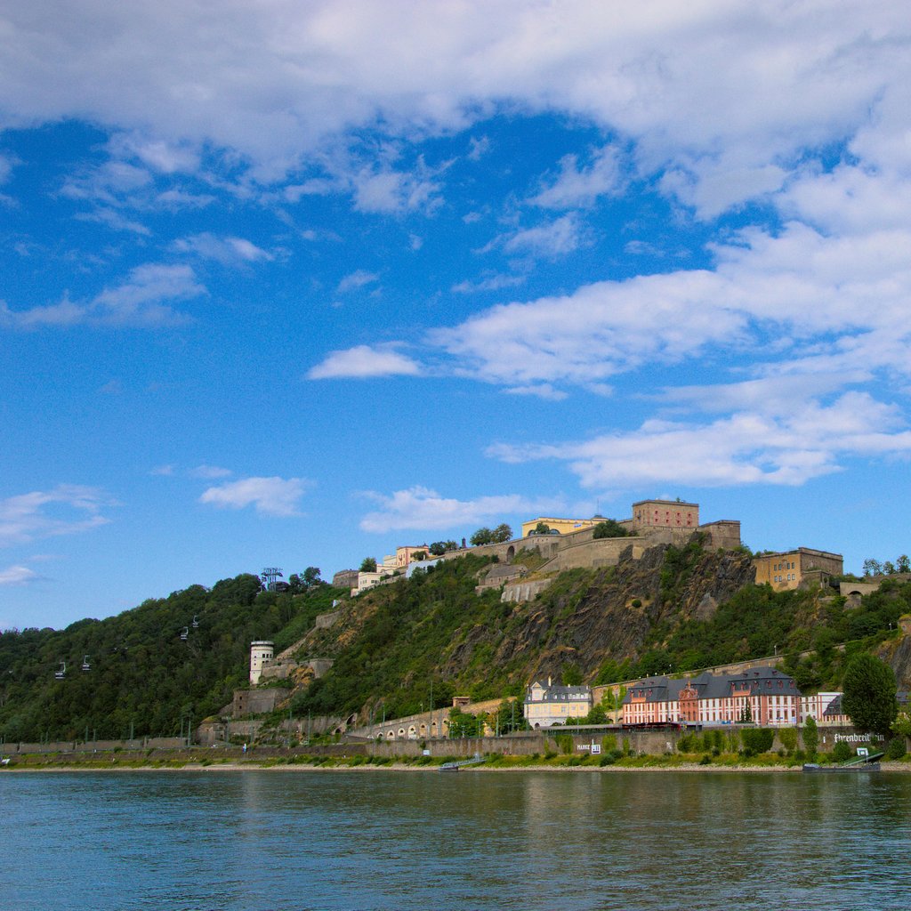 Scenic view of Ehrenbreitstein Fortress and Koblenz along the Rhine River on a clear day.