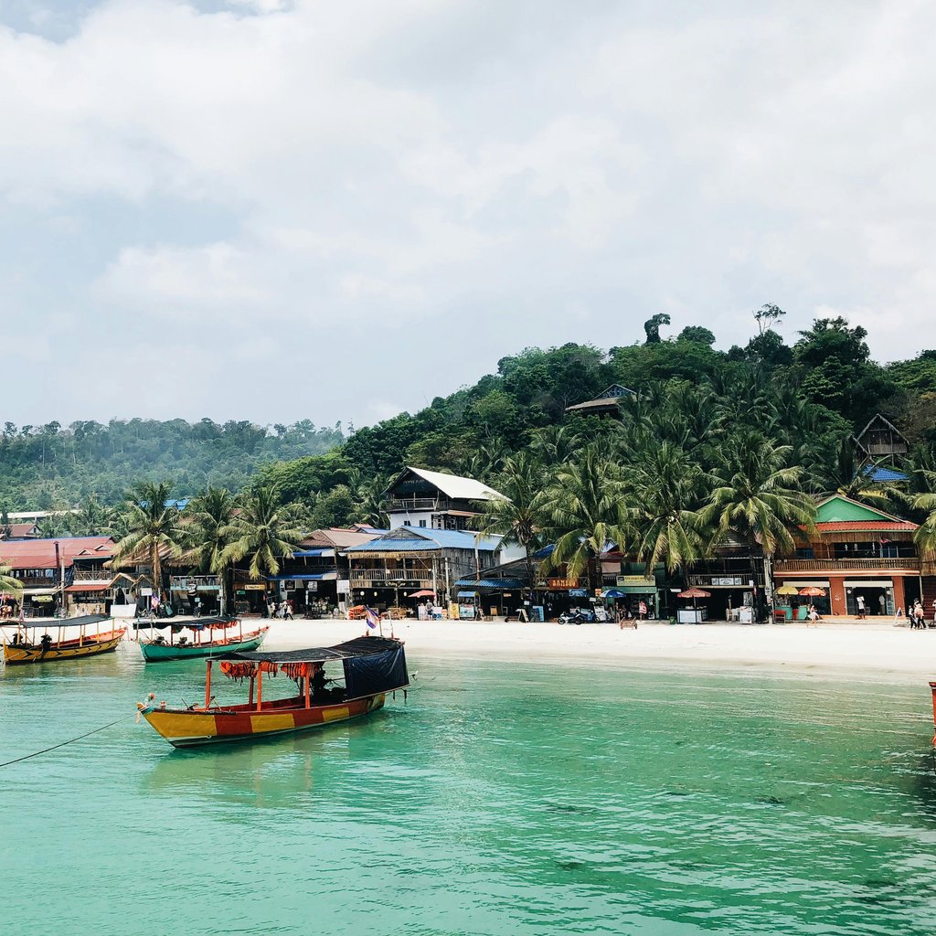 Scenic view of tropical beach and boats in Sihanoukville, Cambodia.