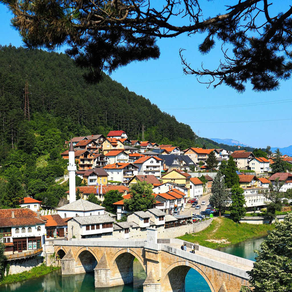 Stara Ćuprija bridge over Neretva River in Konjic, Bosnia and Herzegovina captured in vibrant summer colors.
