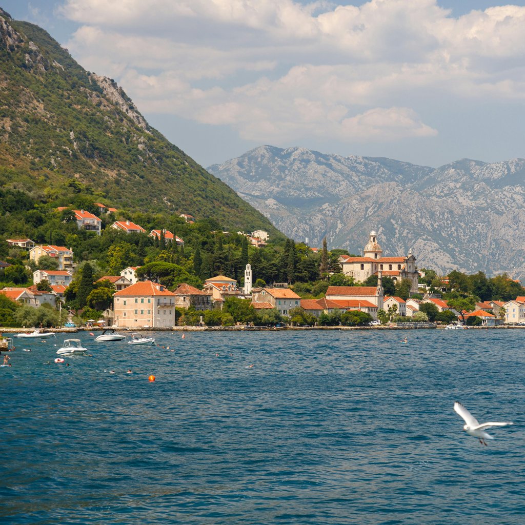 Beautiful coastal town view at Kotor Bay, Montenegro with mountains and sea.