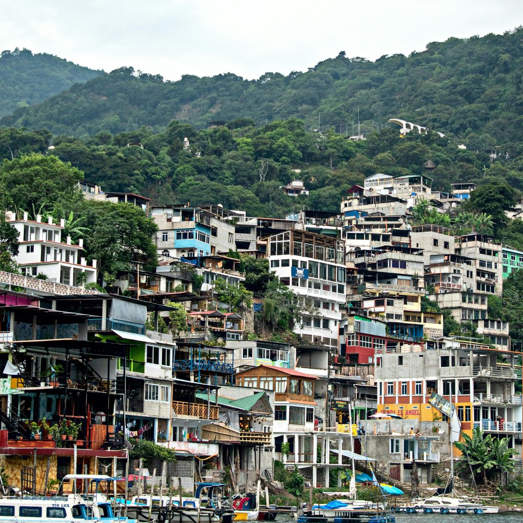 Colorful hillside buildings in Santiago Atitlán, Guatemala, by Lake Atitlán.