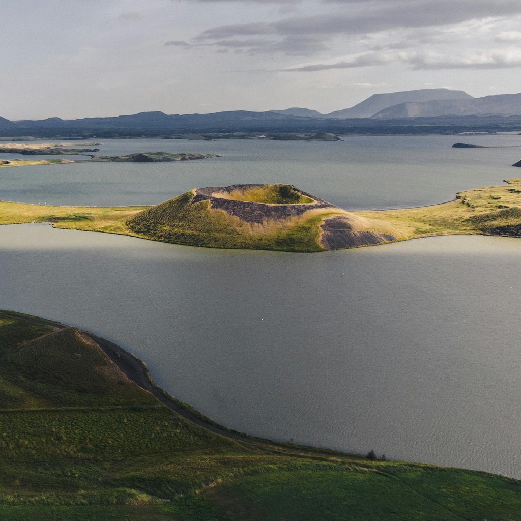 A breathtaking aerial view of Lake Mývatn and its craters in Iceland, showcasing unique geological formations.