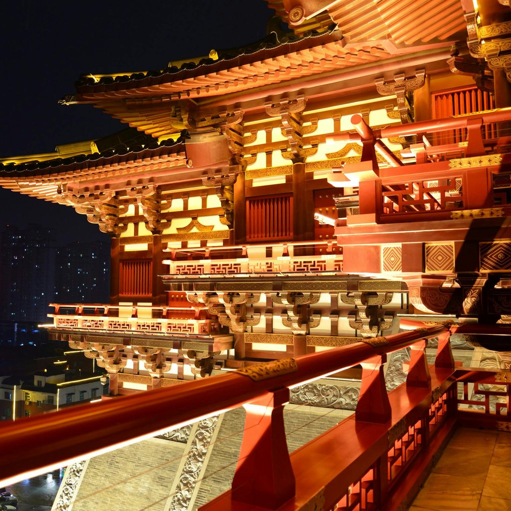 Stunning view of the ornate and illuminated Yingtian Gate at night in Luoyang, China.