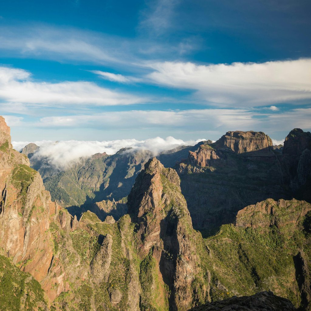Explore the stunning mountain peaks and panoramic views from Pico do Arieiro in Madeira, Portugal.