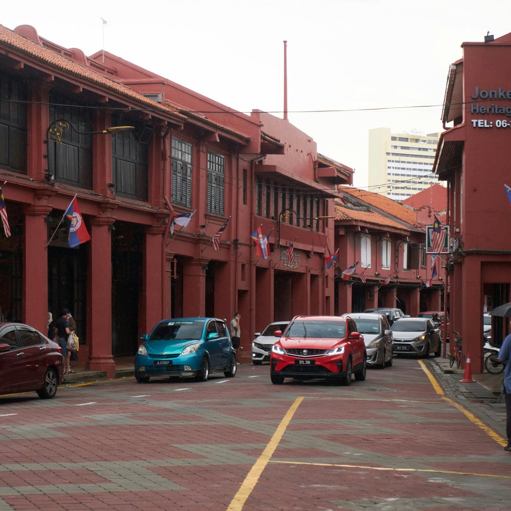 Captivating view of heritage buildings and traffic in Malacca, Malaysia.