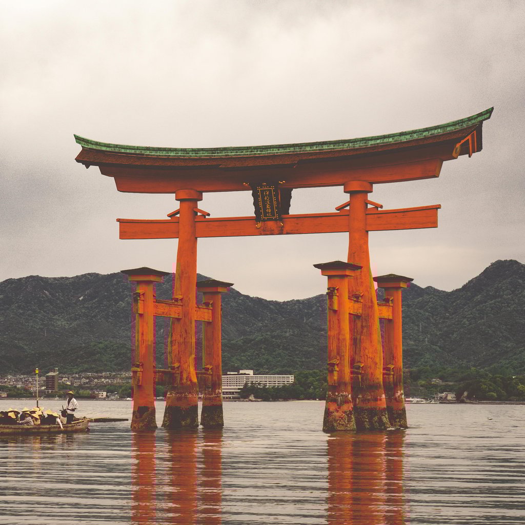 Picturesque scene of the iconic Itsukushima Shrine torii gate on Miyajima Island, Hiroshima, Japan.
