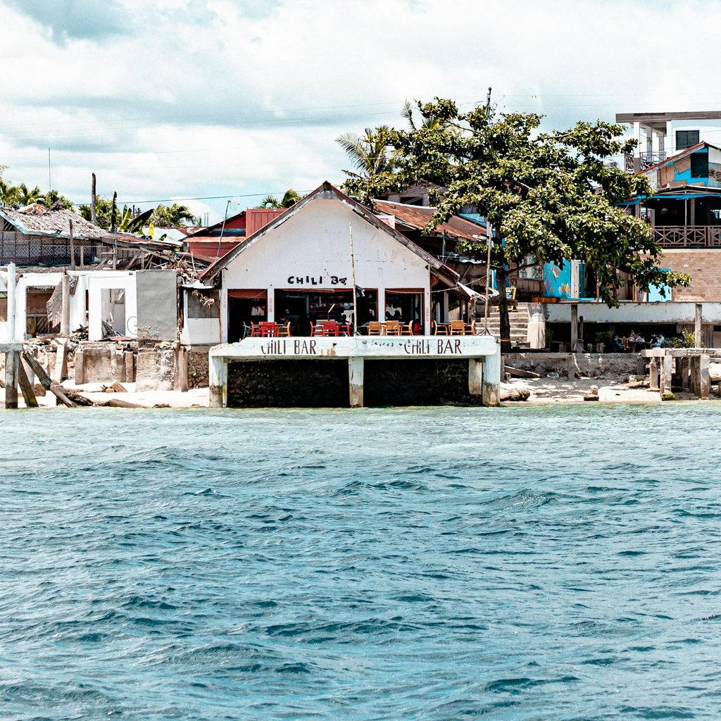 Bright coastal bar setting in Moalboal, Philippines with a serene ocean view.