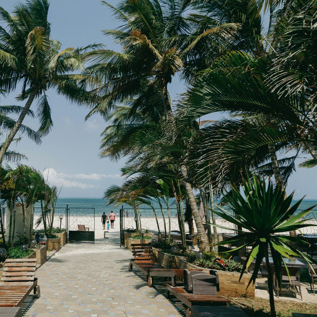 Relax at a tropical beachfront paradise in Mombasa, Kenya.