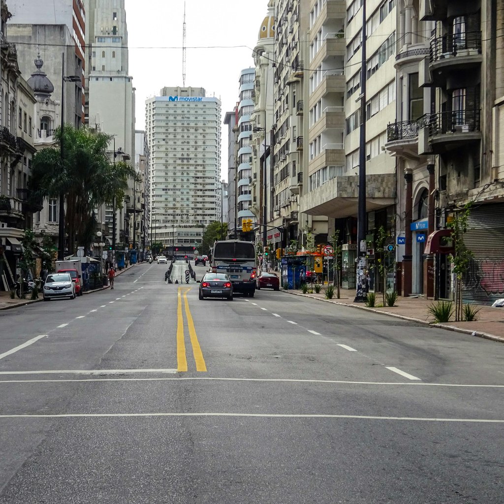 City street view in Montevideo, Uruguay showing urban architecture and moderate traffic.