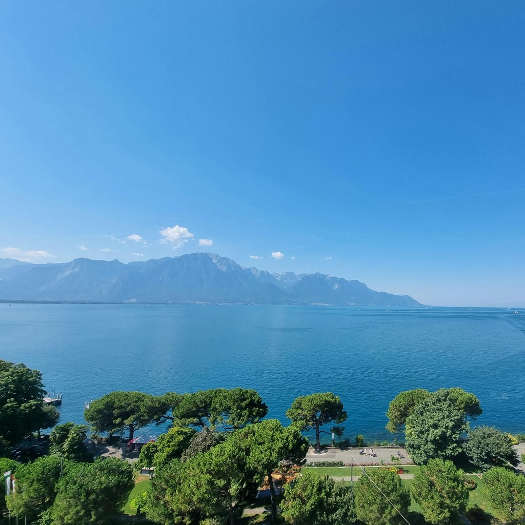 Aerial view of Montreux, Switzerland, with Lake Geneva and surrounding mountains.