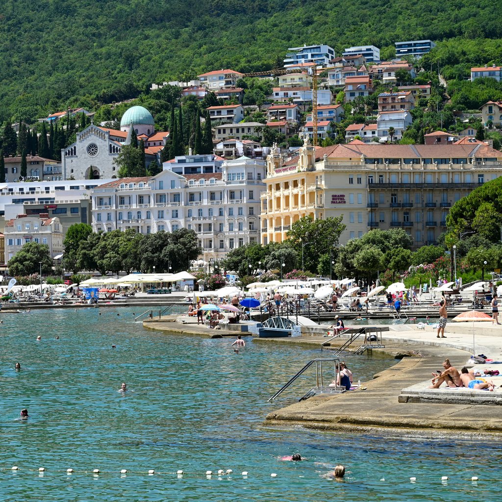 Explore the beautiful coastline and architecture of Opatija, Croatia, in a summer setting.