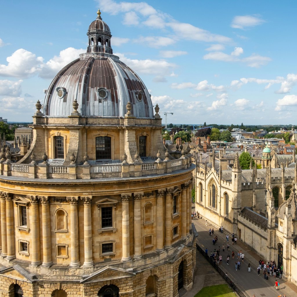 A beautiful aerial view of Oxford University's classic architecture on a bright day.