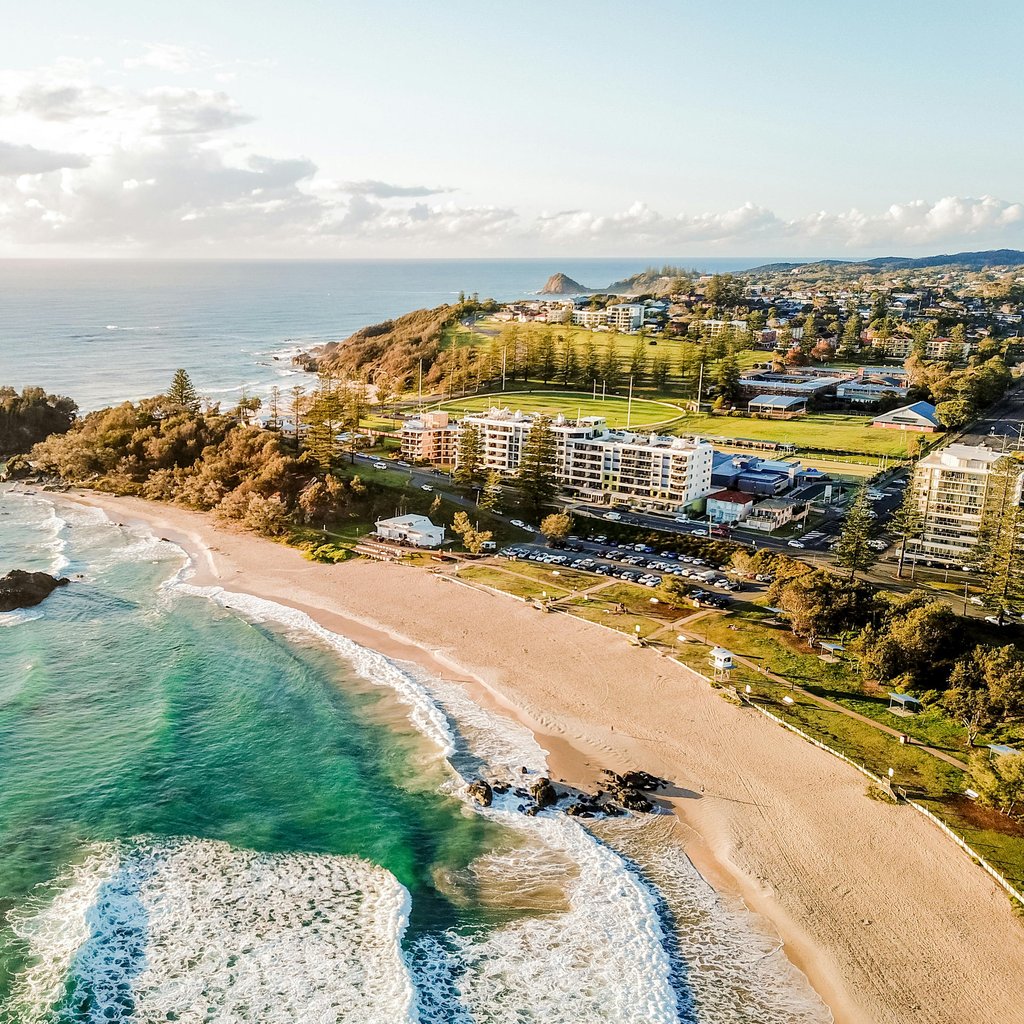 Stunning aerial view of Port Macquarie's sandy beaches and vibrant coastline, perfect for travel and tourism enthusiasts.