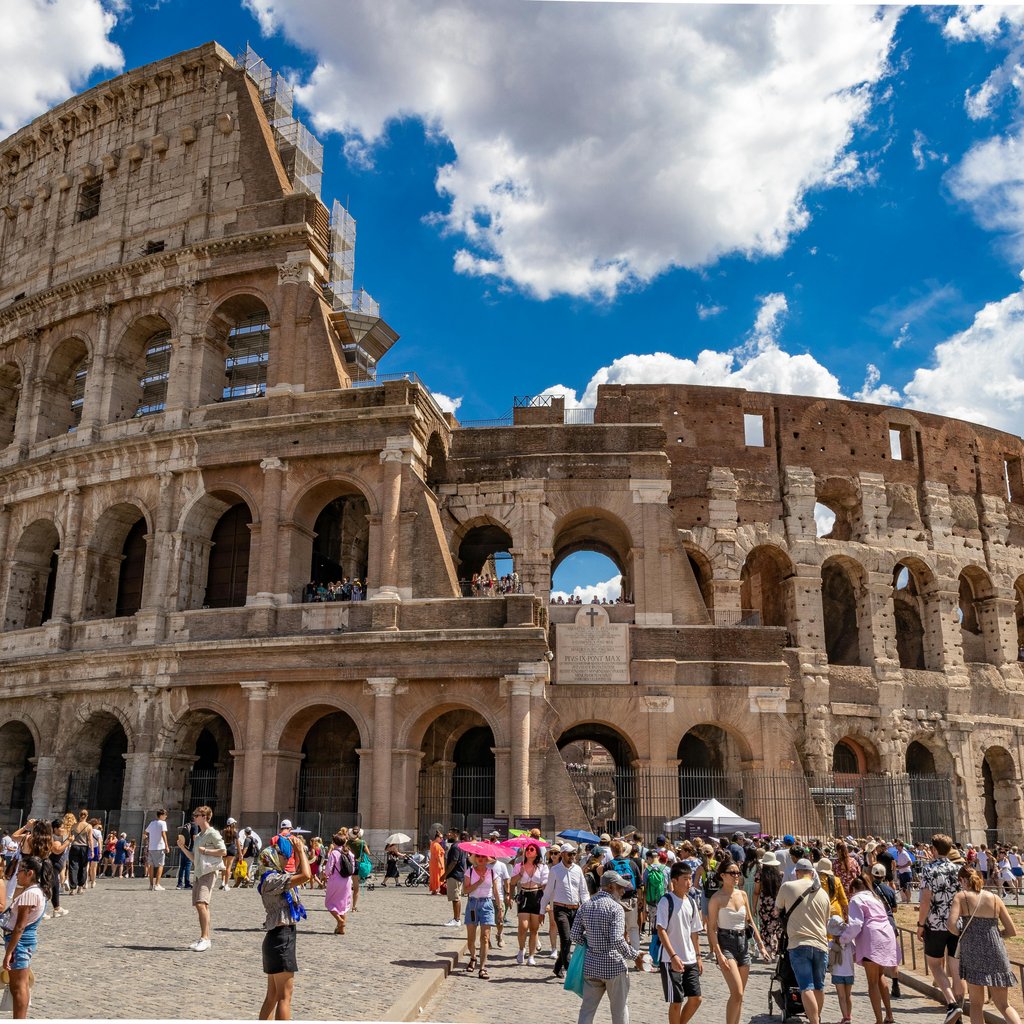 Explore the ancient Colosseum in Rome, a stunning architectural marvel attracting many tourists.