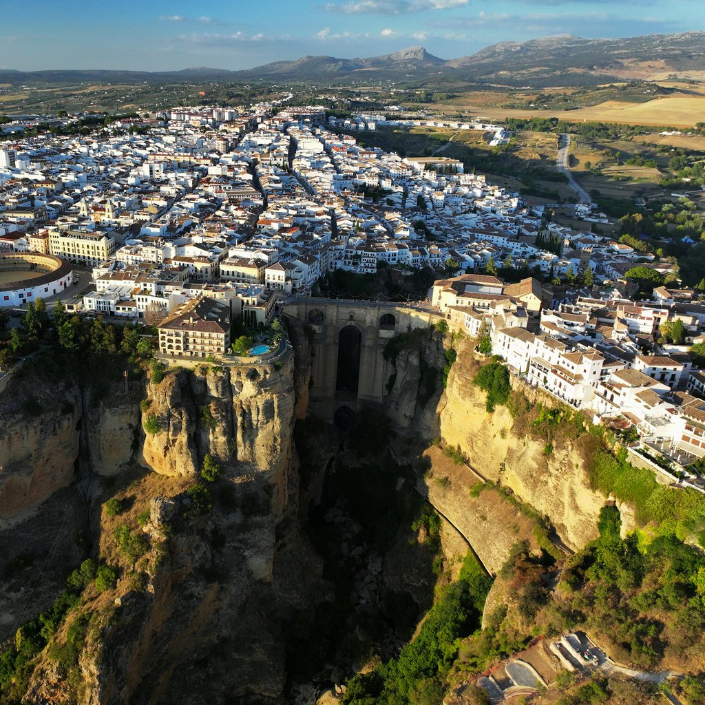 Stunning aerial view of Ronda, Spain showcasing the iconic Puente Nuevo spanning the dramatic gorge.