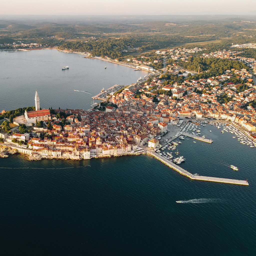 Stunning aerial view of Rovinj's historic peninsula with red rooftops by the Adriatic Sea in Croatia.