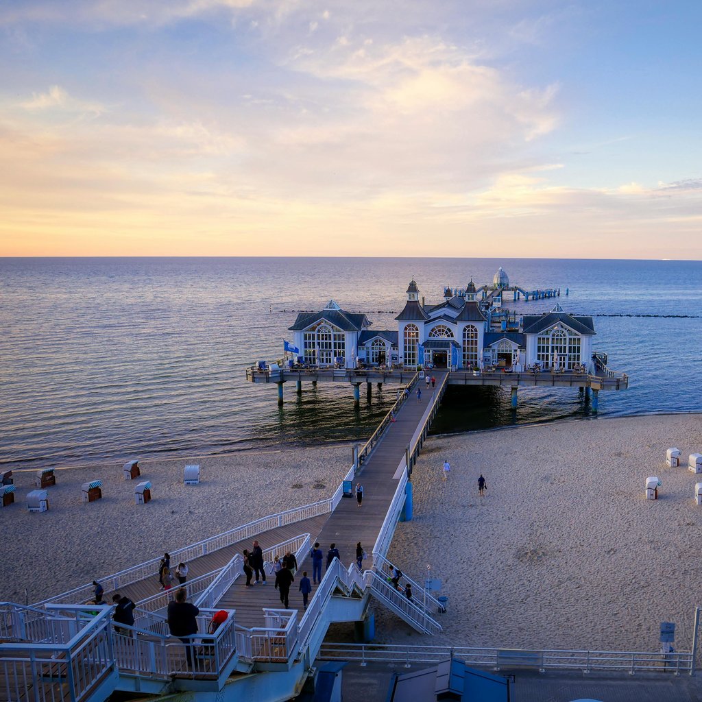 Breathtaking view of Sellin Pier at sunset, located on Baltic Sea, Germany. Perfect for beach tourism.