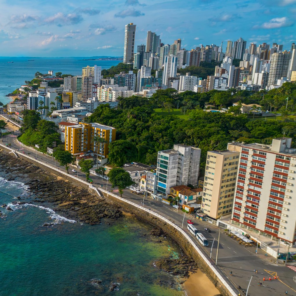 Stunning aerial view of a vibrant coastal cityscape in Porto Seguro, Brazil.