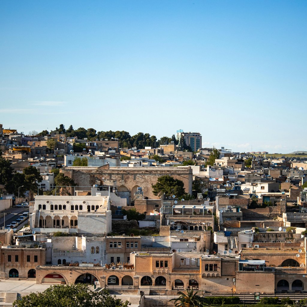 Aerial view of historic Sanliurfa showcasing traditional architecture and vibrant landscapes.