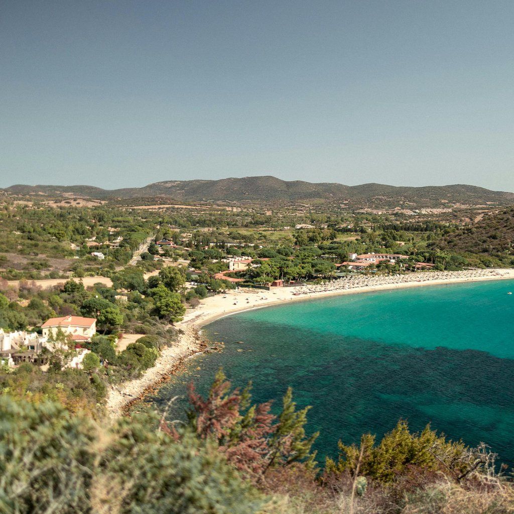 A breathtaking aerial view of the pristine beaches and turquoise waters of Sardinia, Italy.